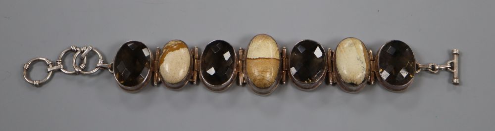 A white metal, oval smoky quartz and oval hardstone set bracelet, approx. 20.5cm, gross 81.5 grams.